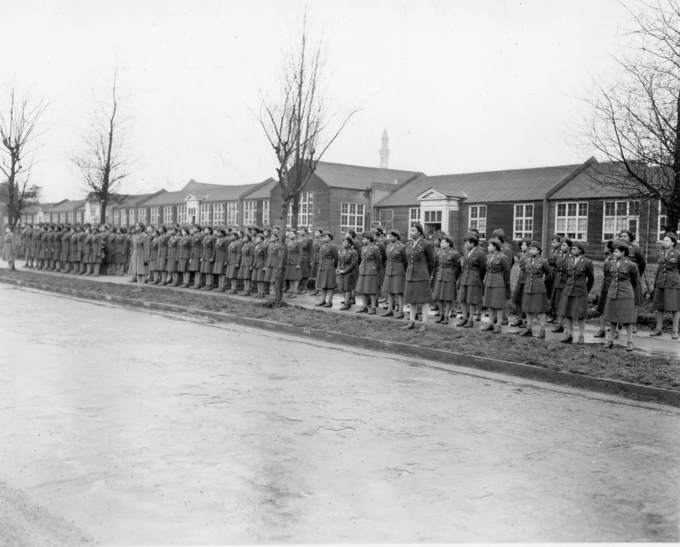 A line of women Soldiers stand ready for inspection. 