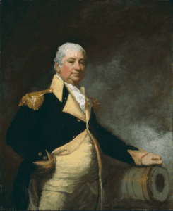 Painting of an older man in an early American military uniform. His left hand rests on a cannon and his right hand is on his hip. 