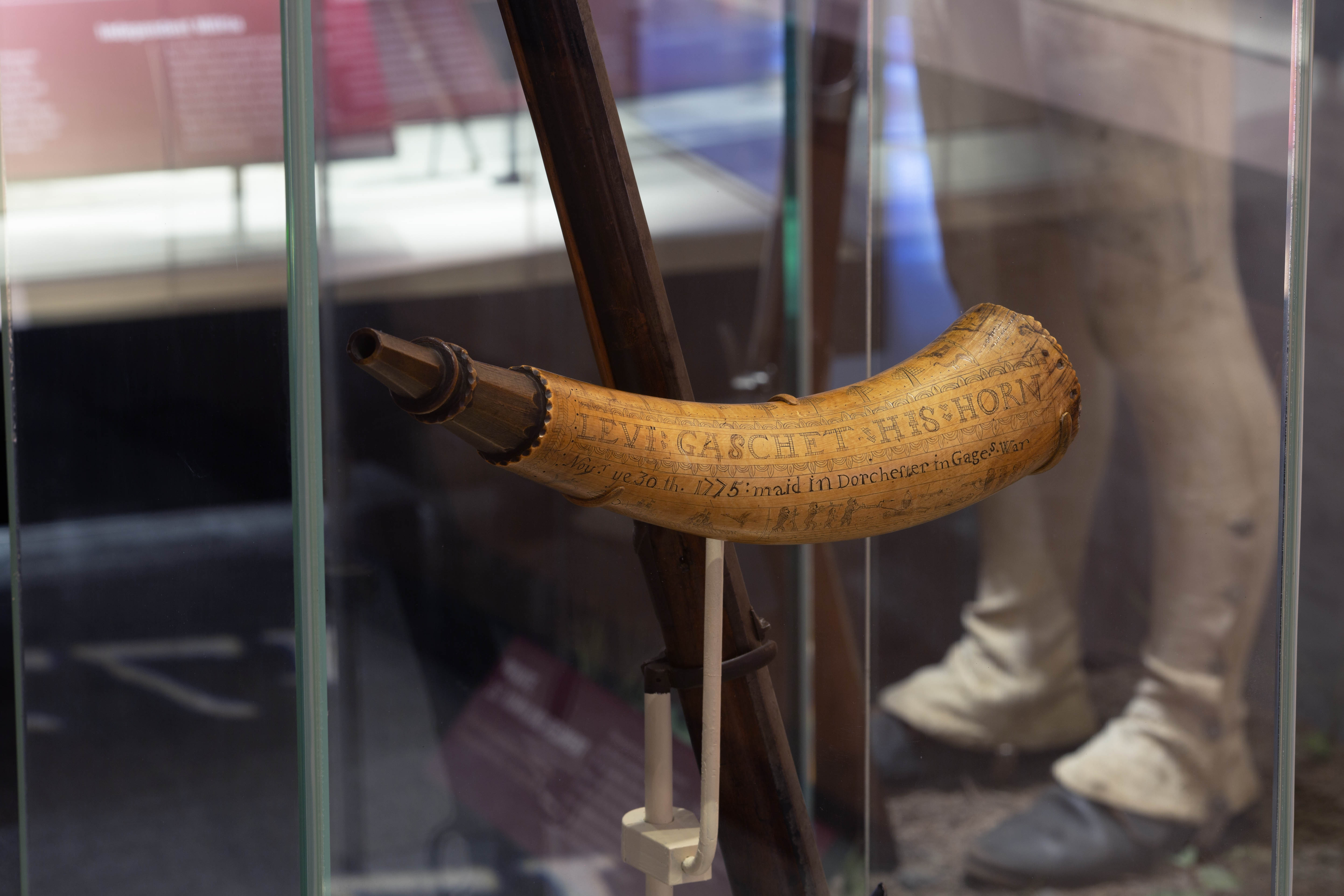 This powder horn, made from a cow’s horn with a wood plug at the larger end, belonged to Sgt. Levi Gaschet during the Revolutionary War. Sergeant Gaschet enrolled in the Northborough Minutemen in 1775 and served at the Siege of Boston. The engraving on the horn commemorates his service on Dorchester Heights during the siege. American militia often provided their own equipment. Many of them carried a personal powder horn to keep gunpowder dry and to facilitate loading their muskets or rifles.