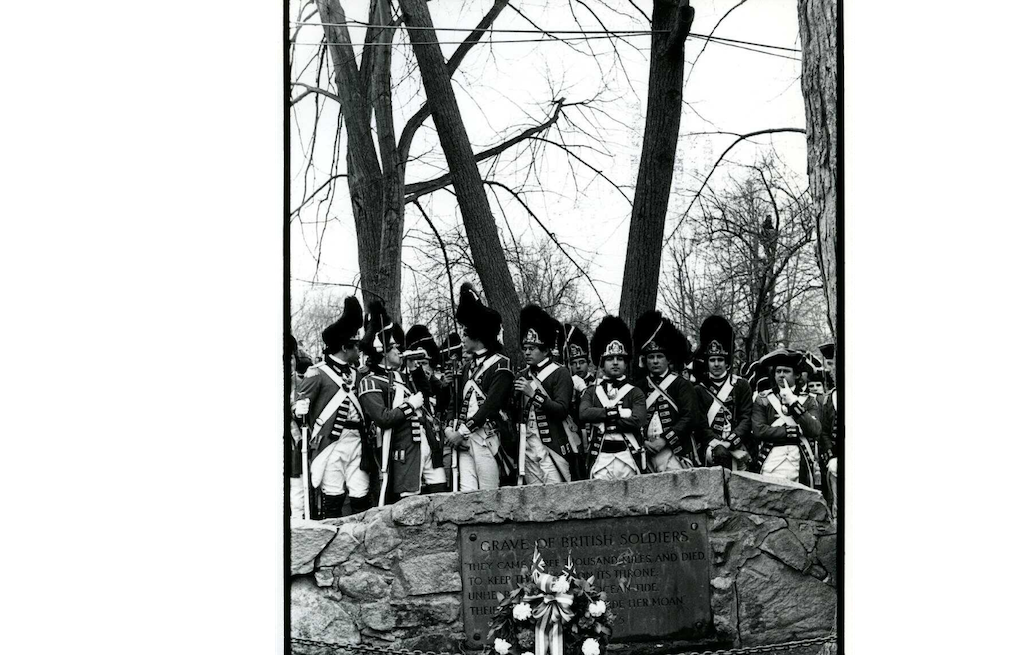 Men dressed as Redcoats gathered at the Grave of British Soldiers during the Bicentennial Celebration (Special Collections and University Archives, University of Massachusetts, Amherst Libraries)